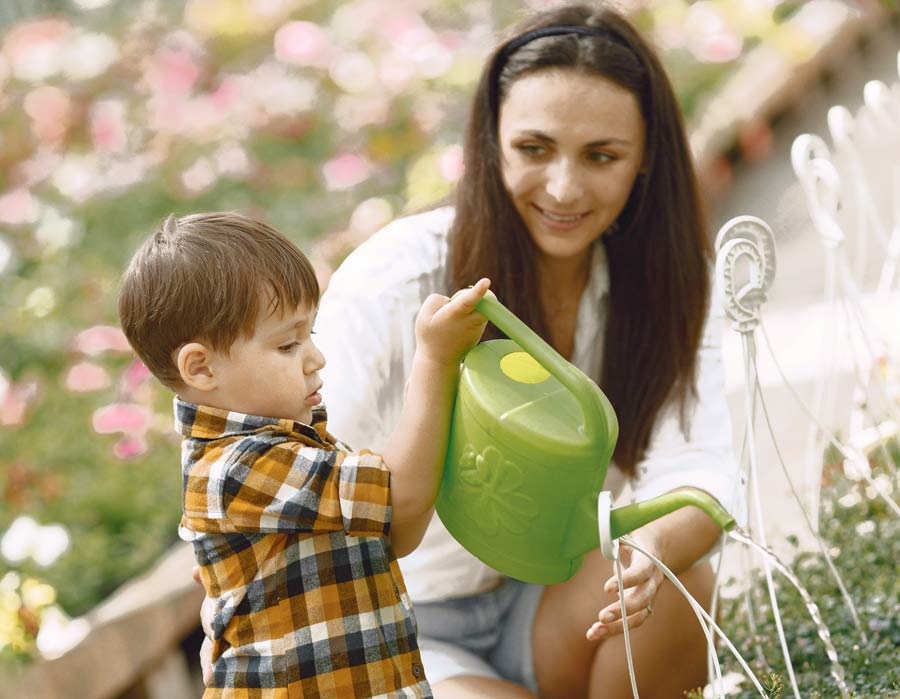 mom her son with green watering